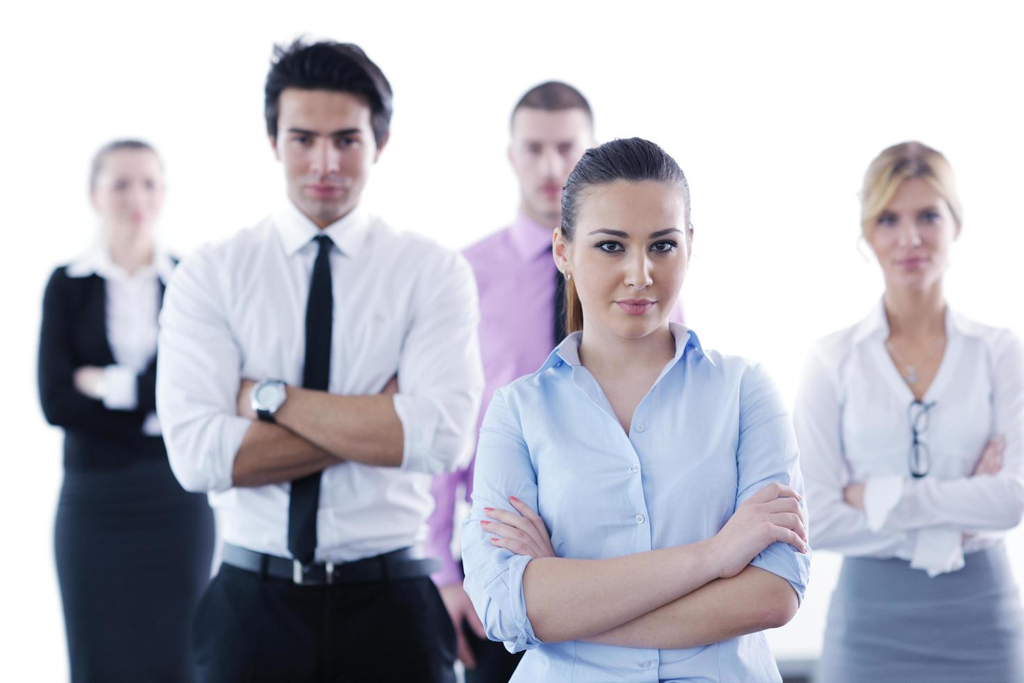 business woman standing with her staff in background photo