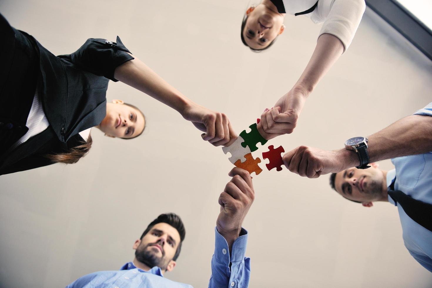 Group of business people assembling jigsaw puzzle 12080326 Stock Photo at  Vecteezy