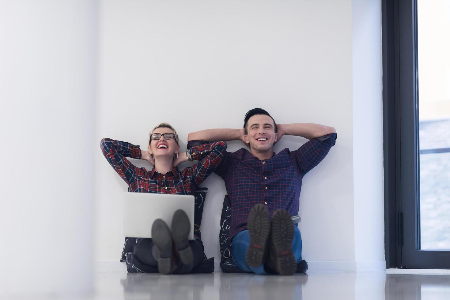 startup business, couple working on laptop computer at office photo