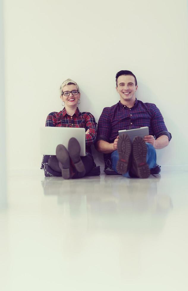 startup business, couple working on laptop computer at office photo