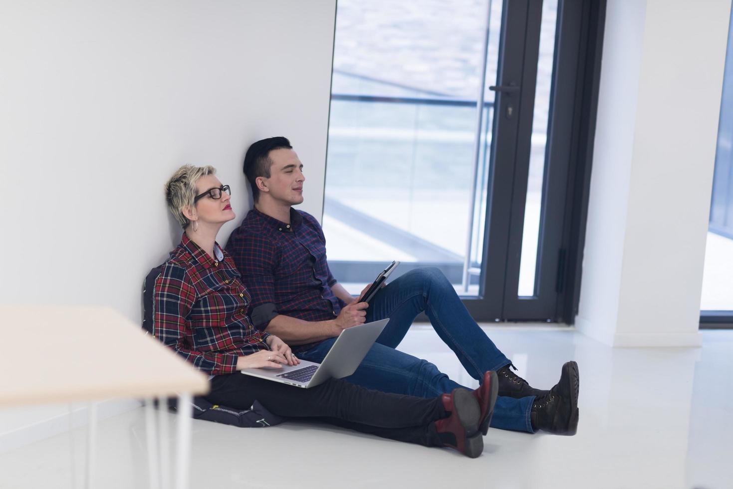 startup business, couple working on laptop computer at office photo