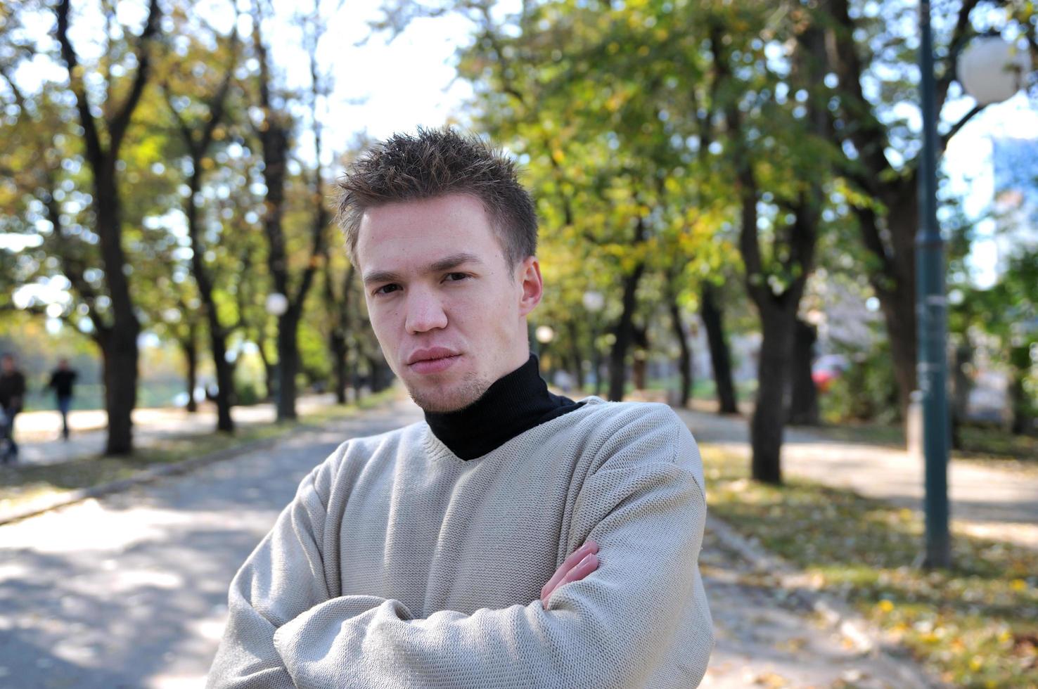 happy young casual man outdoor portrait posing photo