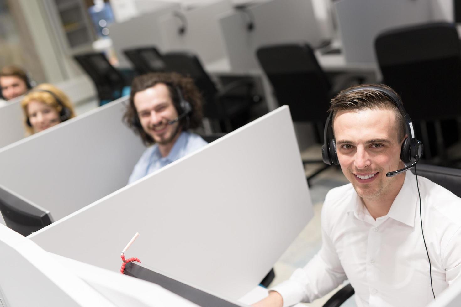 male call centre operator doing his job photo