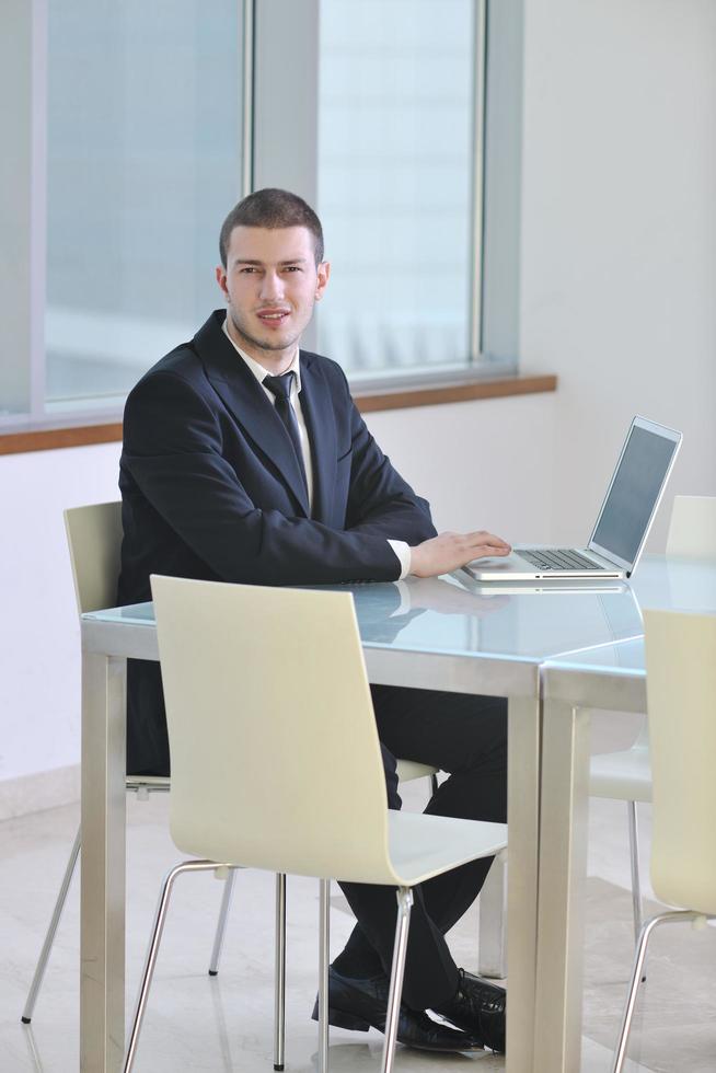 young business man alone in conference room photo