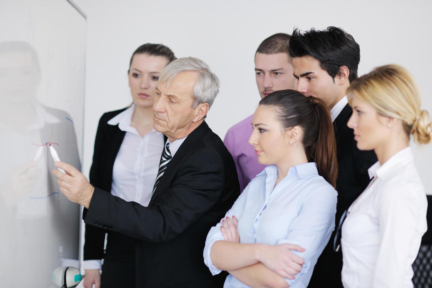 Senior business man giving a presentation photo