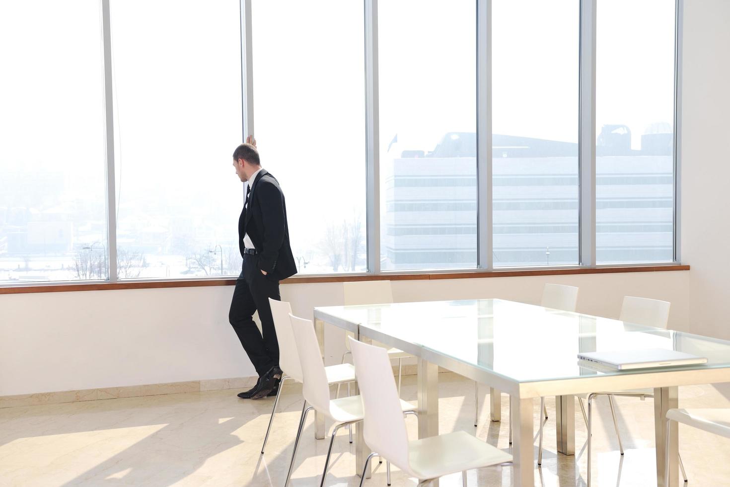 young business man alone in conference room photo