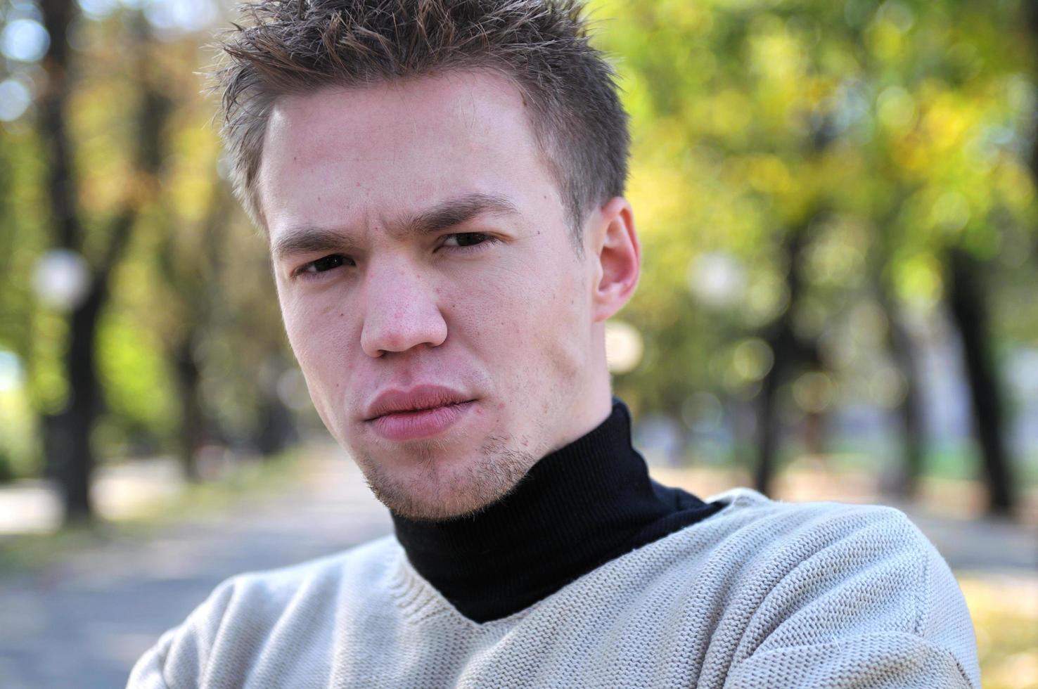 happy young casual man outdoor portrait posing photo