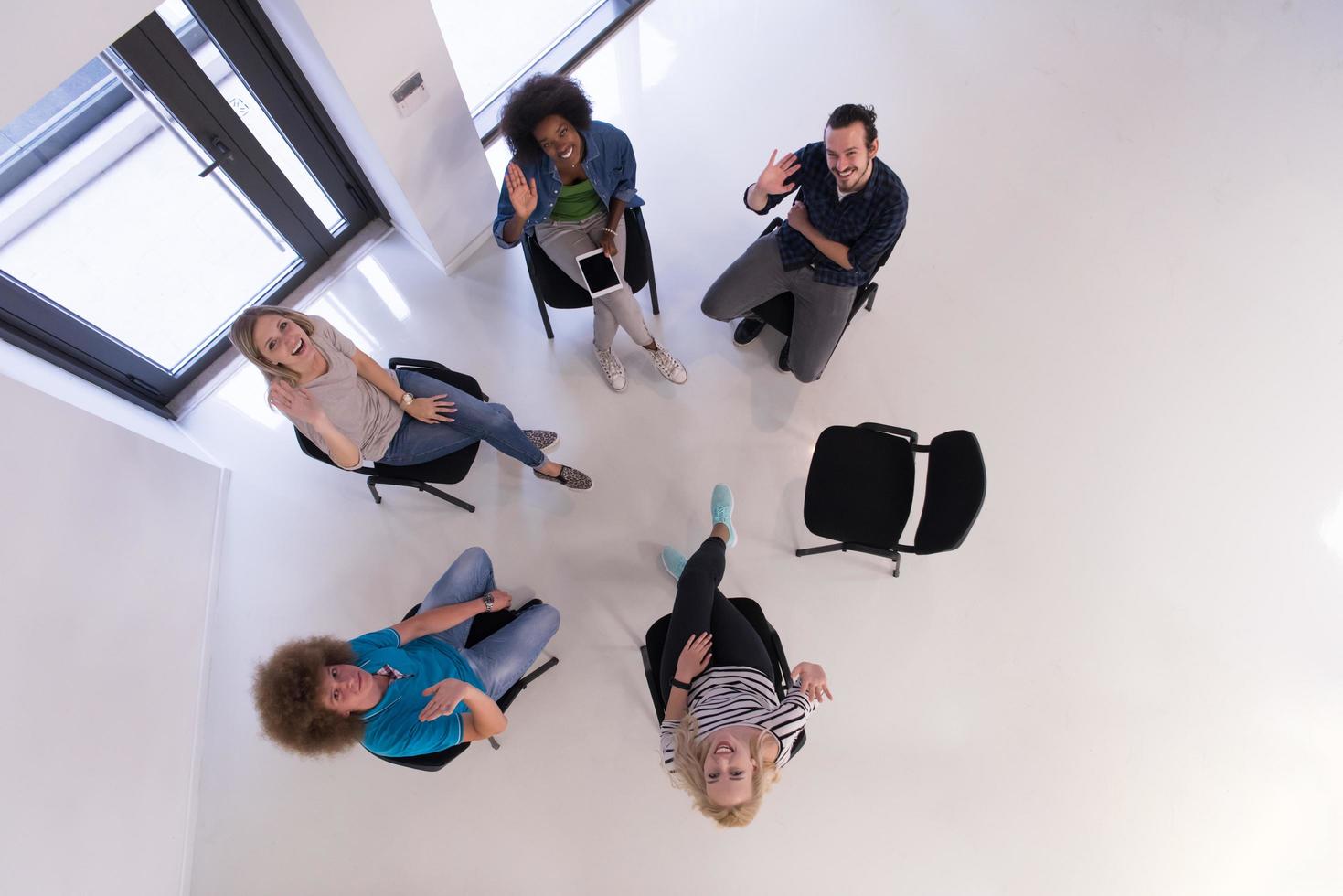 Multiethnic startup business team on meeting  top view photo