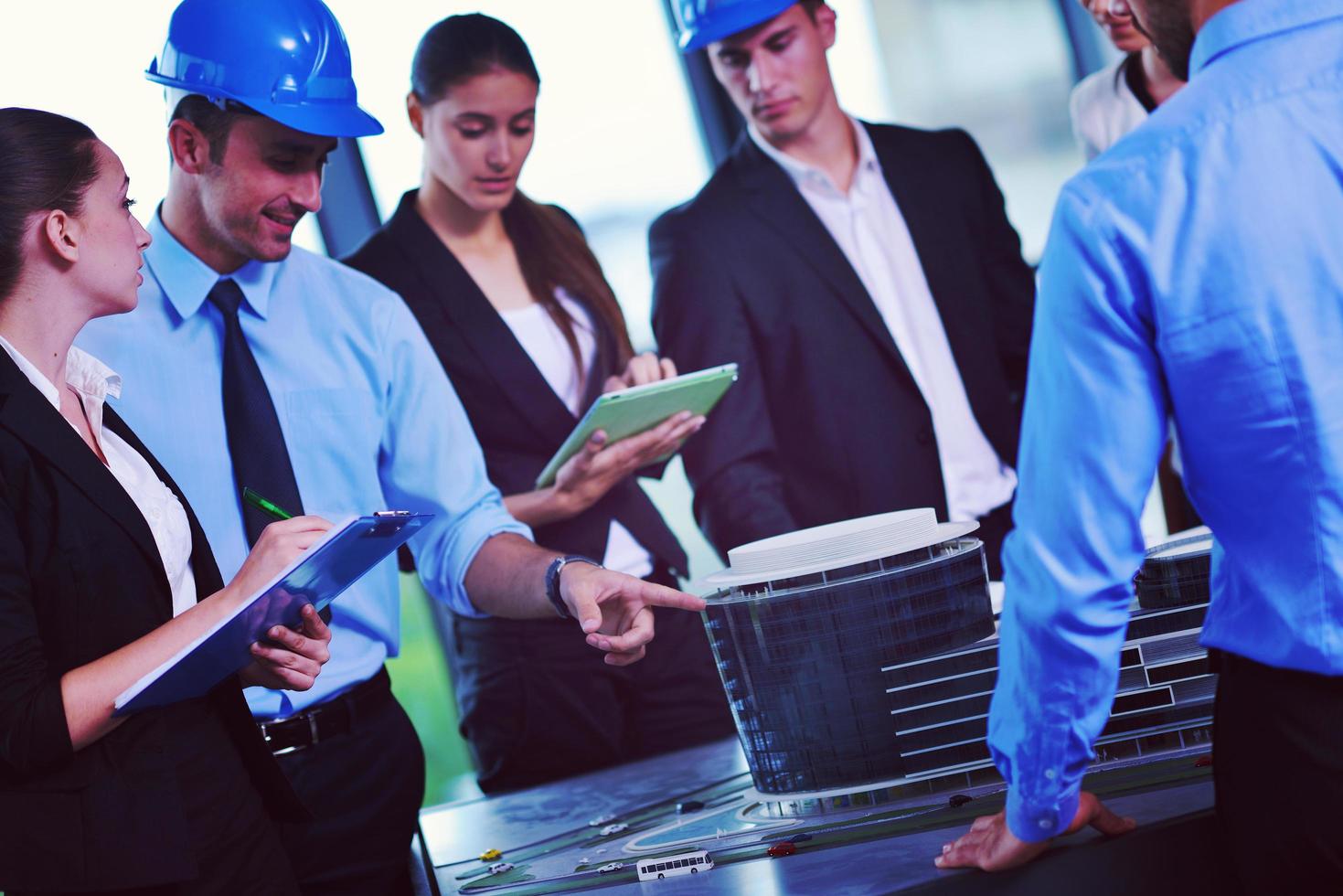 business people and engineers on meeting photo