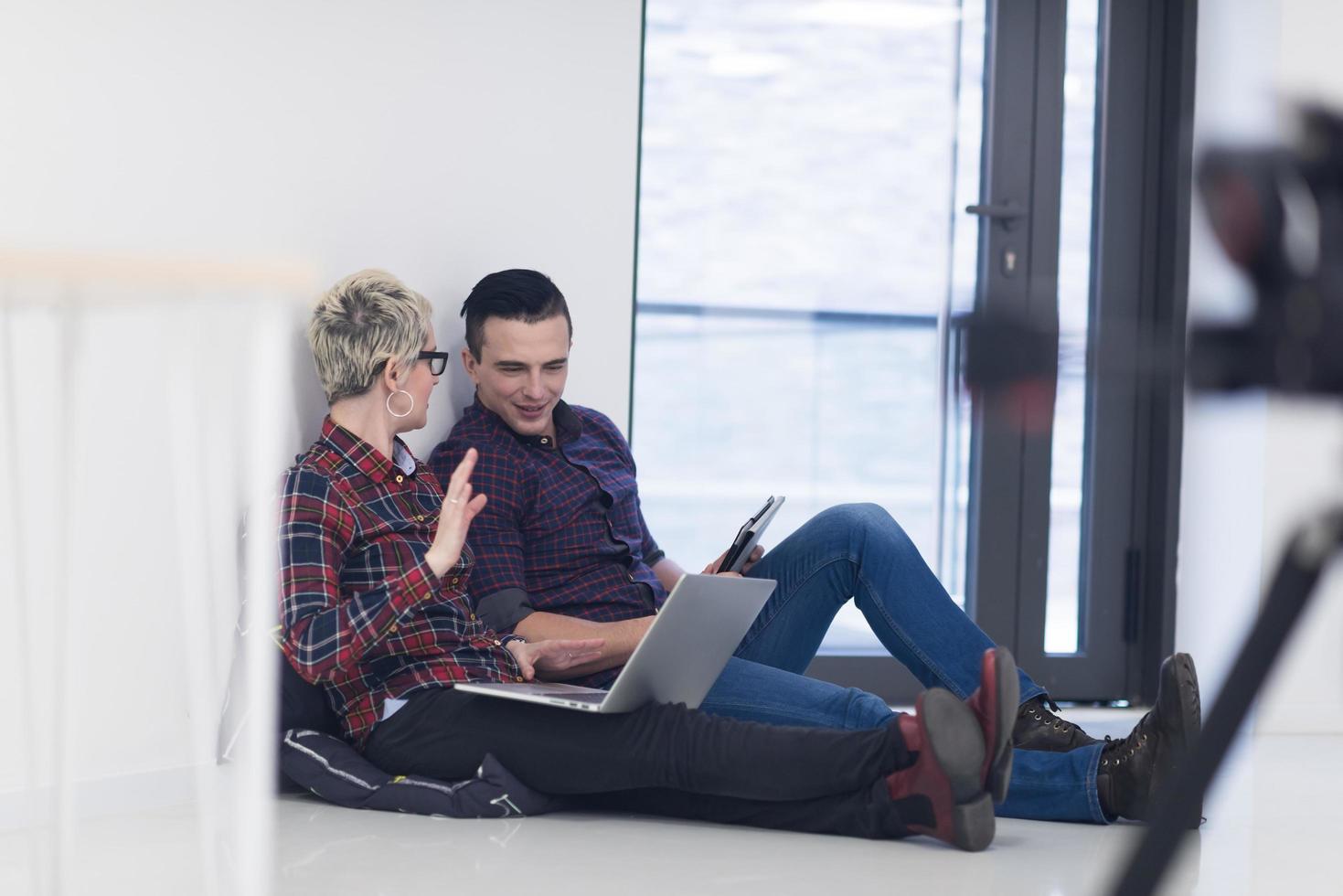 startup business, couple working on laptop computer at office photo