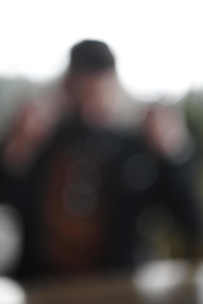 blurred image background business man wearing protective face mask at office photo