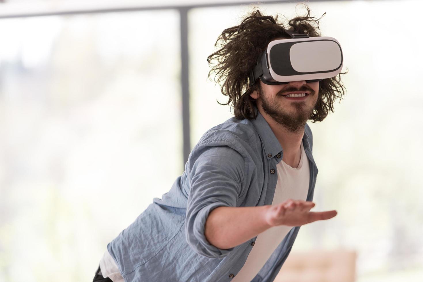 man using VR-headset glasses of virtual reality photo