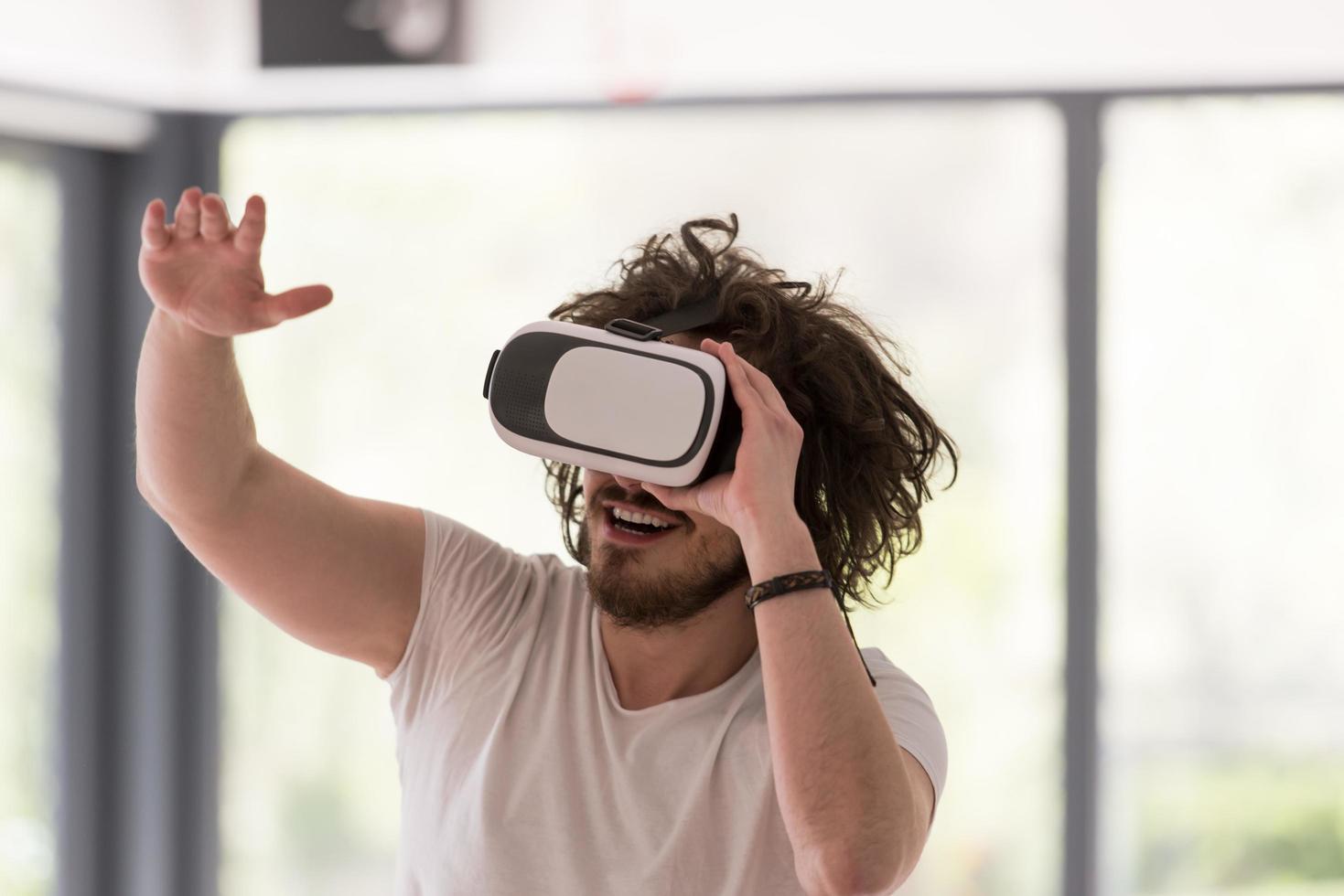 man using VR-headset glasses of virtual reality photo