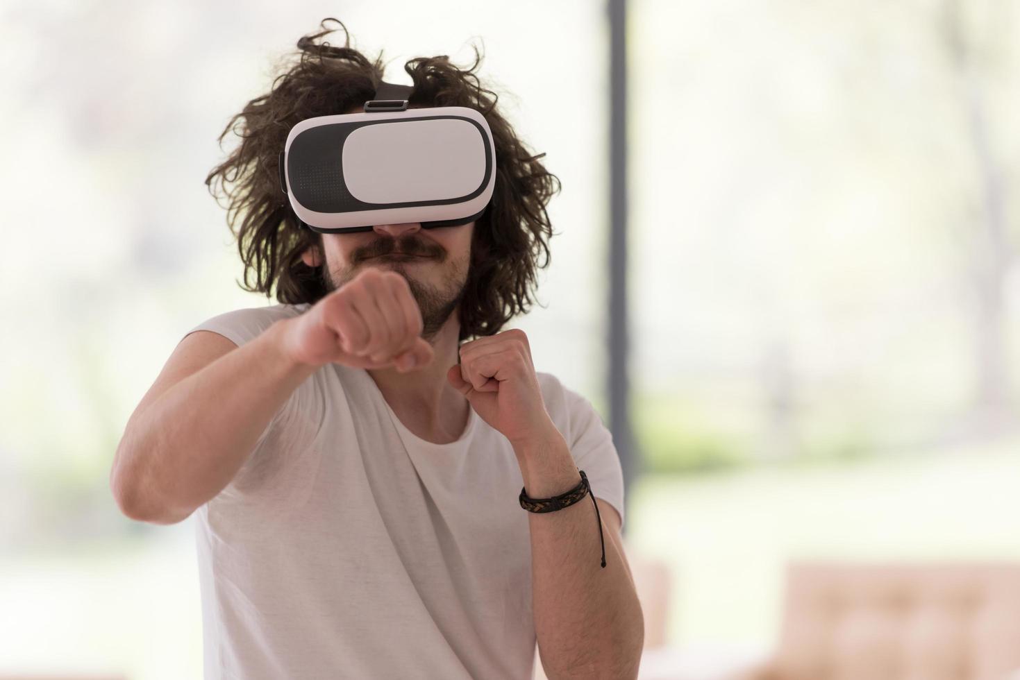 man using VR-headset glasses of virtual reality photo