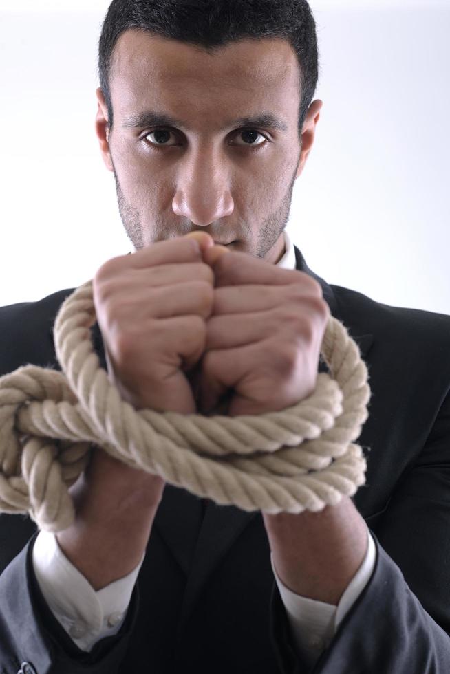 business man with rope isolated on white background photo