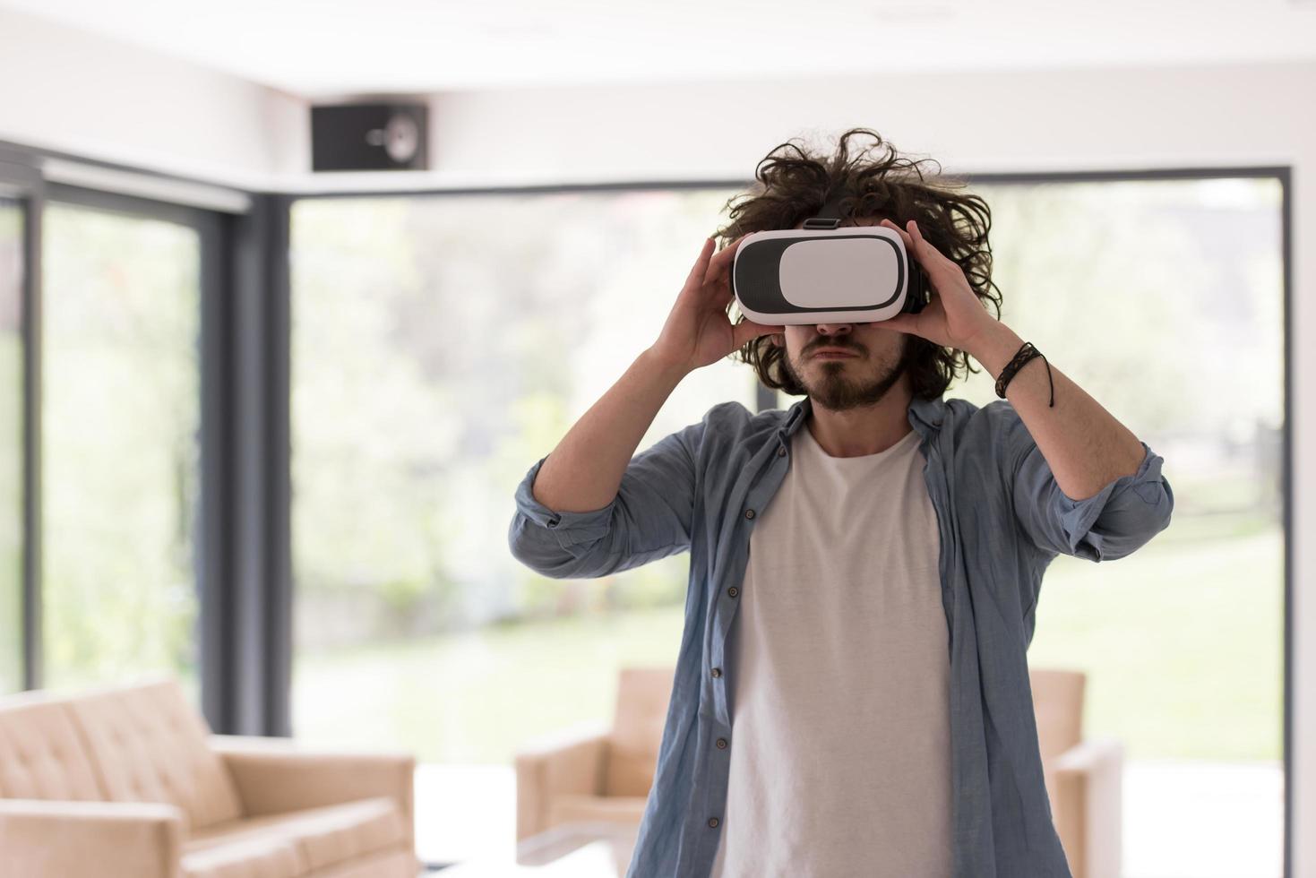 man using VR-headset glasses of virtual reality photo