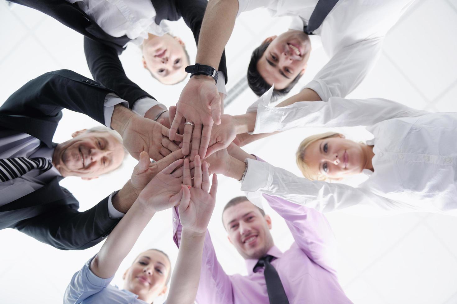 business people group joining hands photo