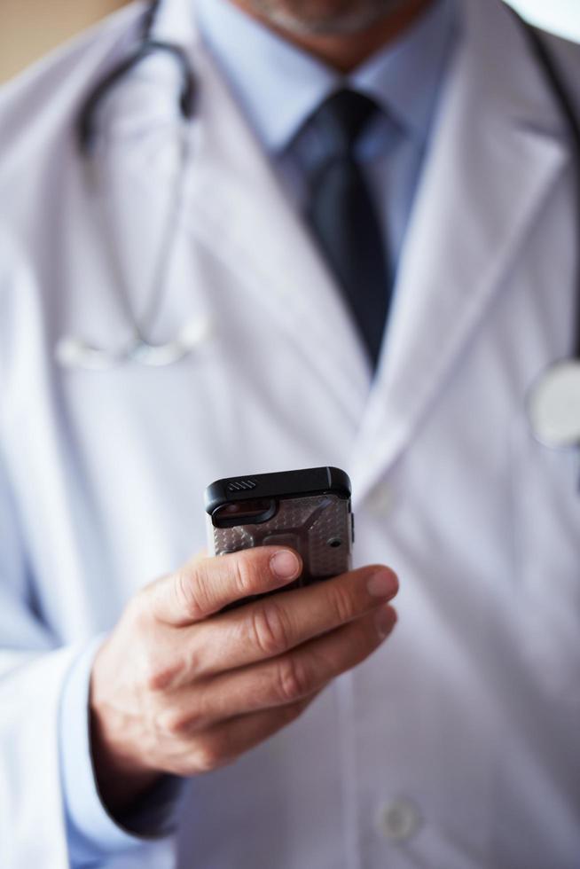doctor speaking on cellphone photo