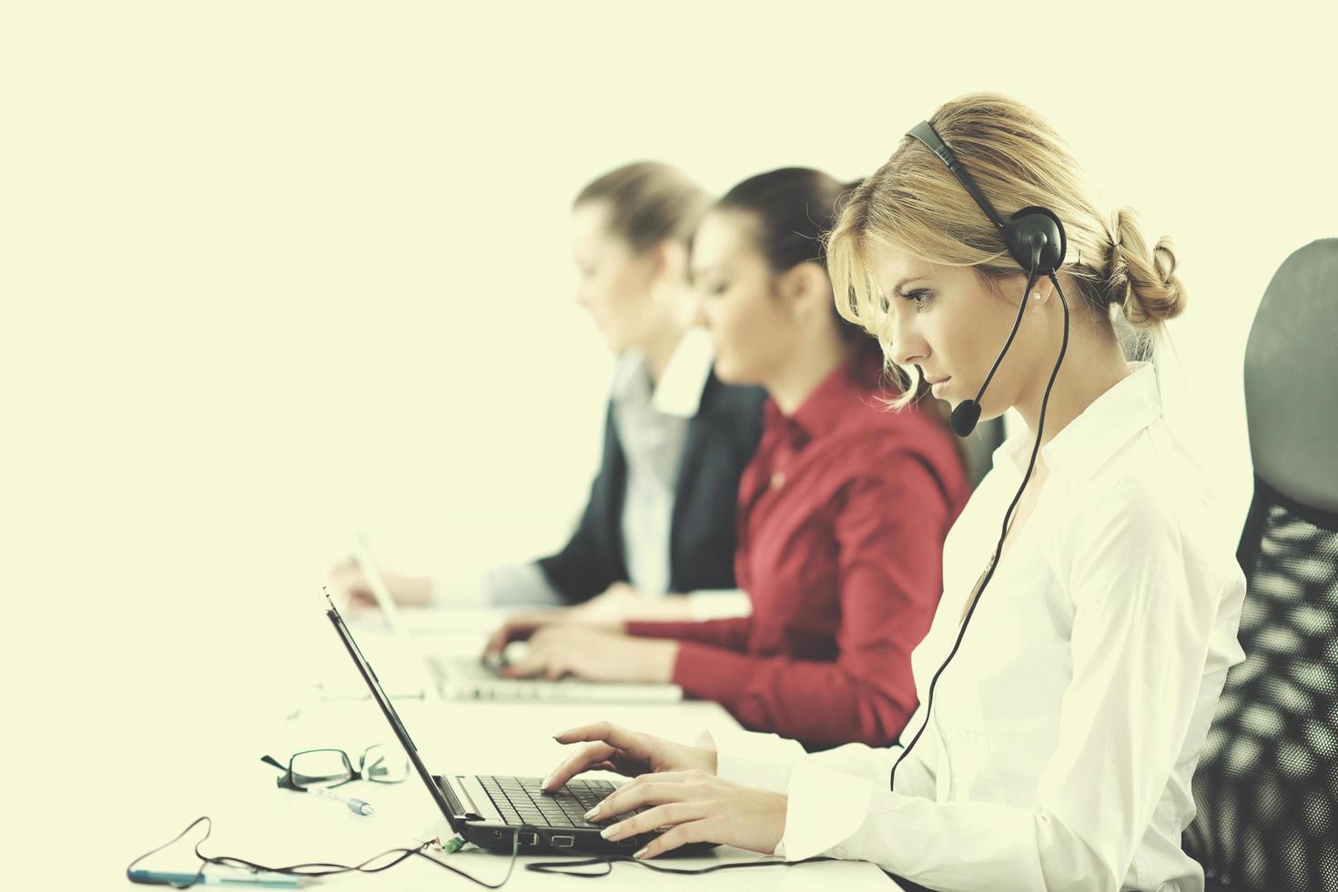 business woman group with headphones photo