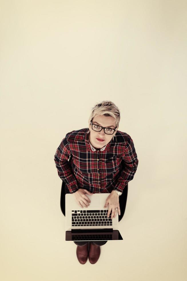 top view of young business woman working on laptop computer photo