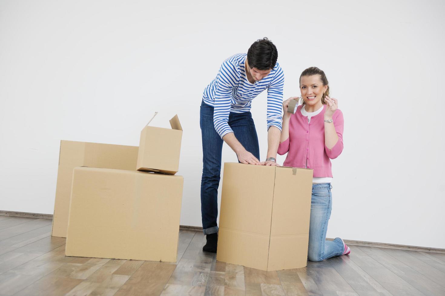 Young couple moving in new house photo