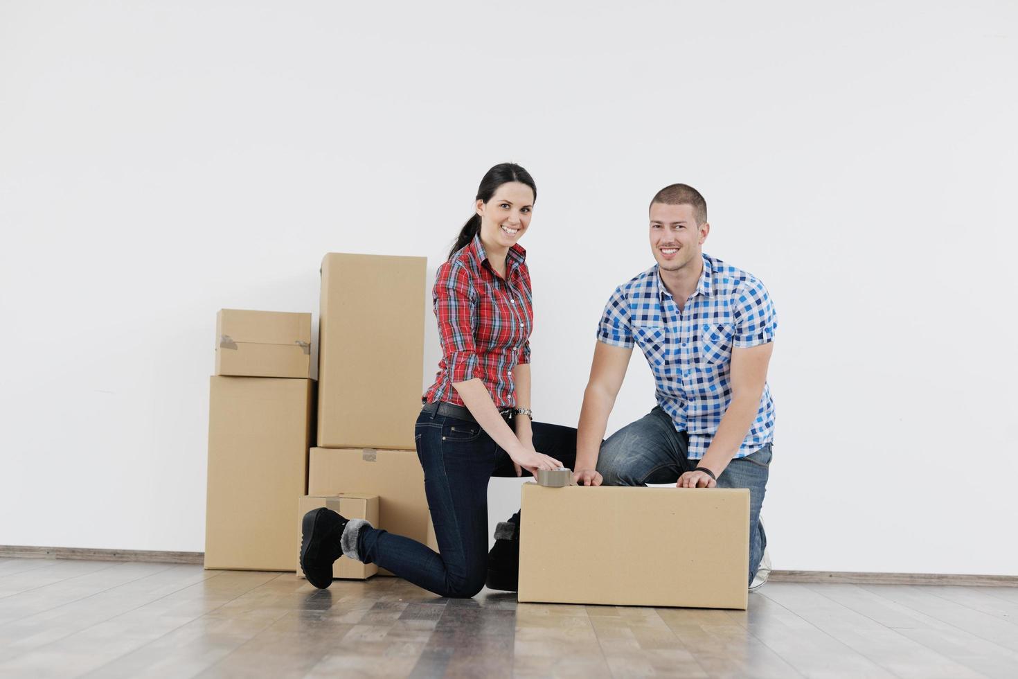 Young couple moving in new house photo