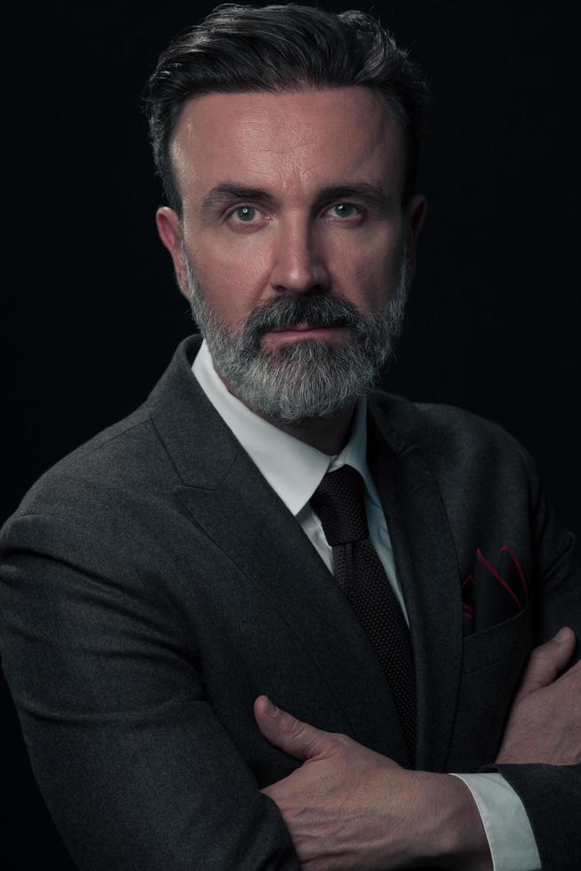 Frustrated middle aged elegant man Close up face of stressed businessman wearing stylish suit with eyes closed. Overworked middle eastern business man with terrible migrain photo