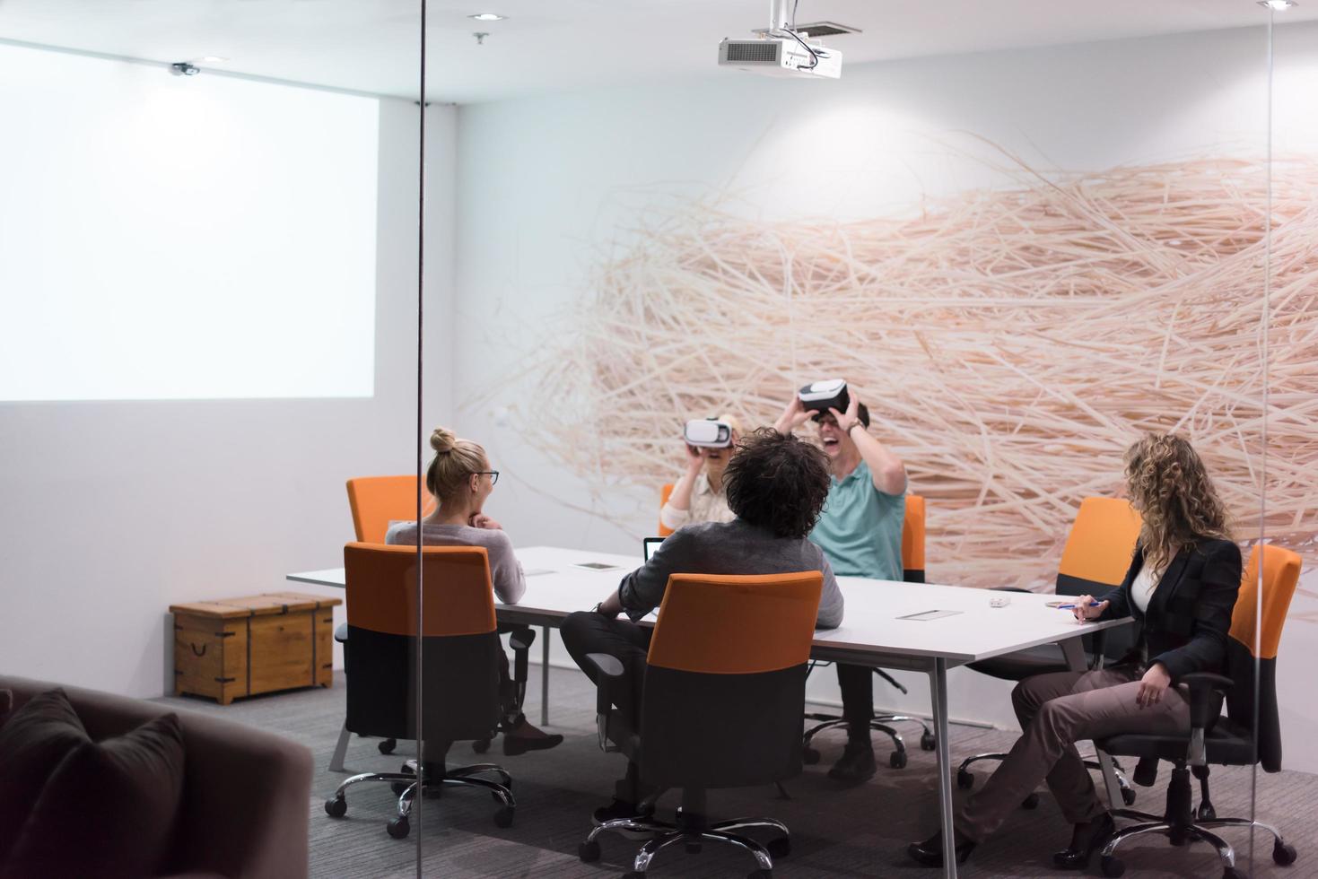 startup business team using virtual reality headset photo