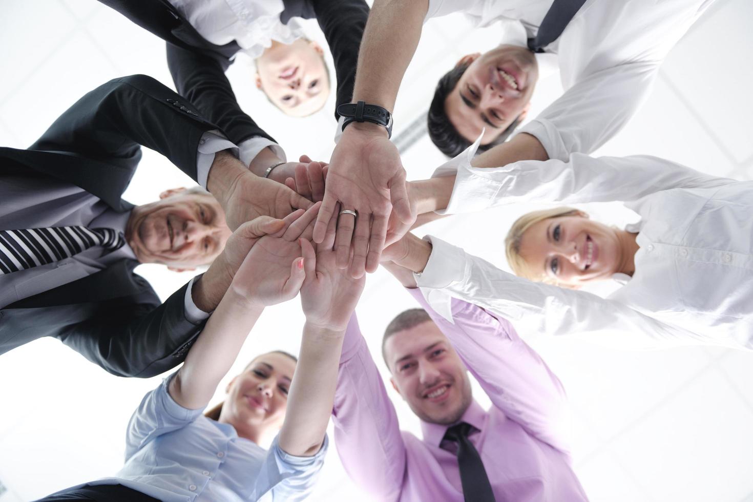 business people group joining hands photo