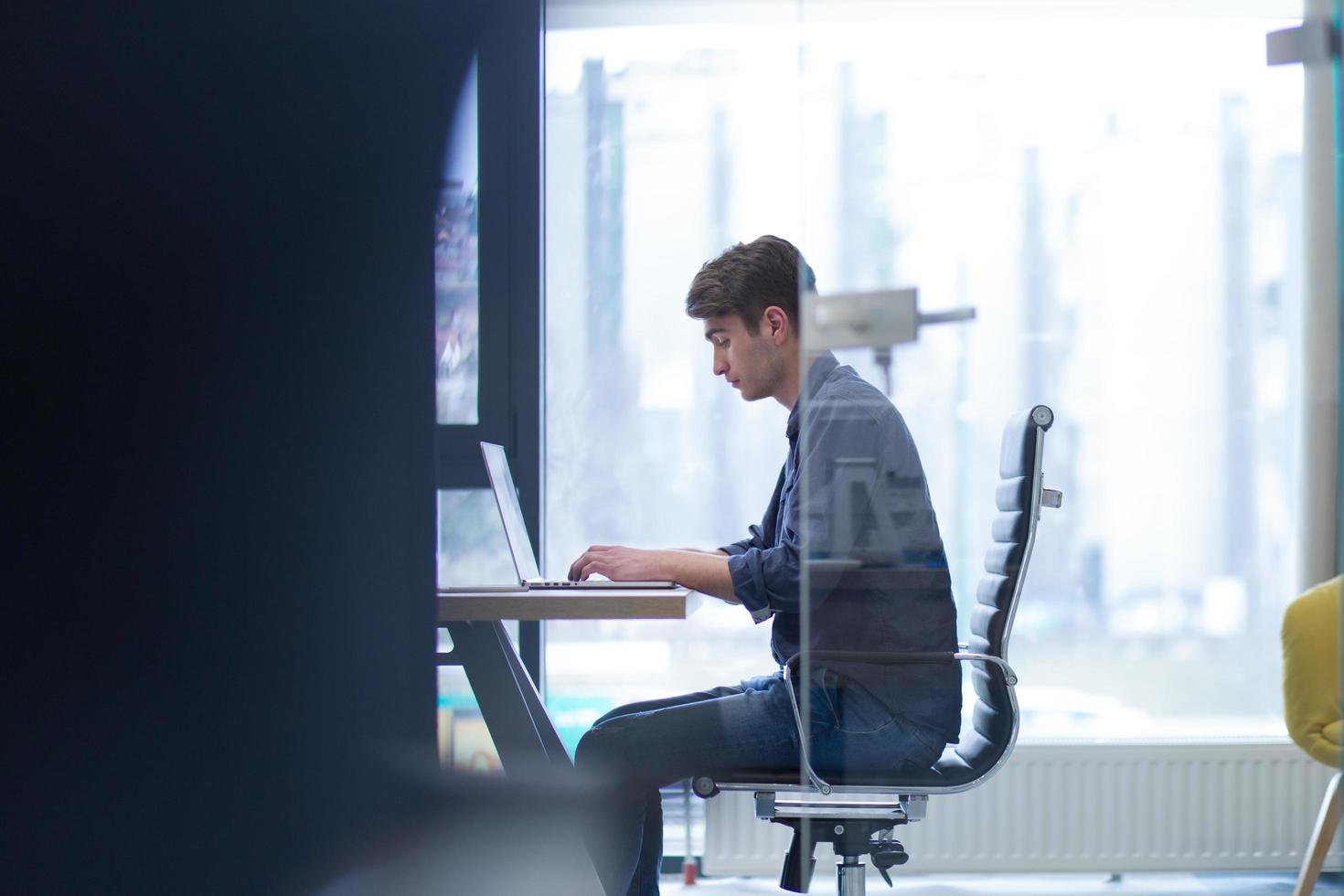 businessman working using a laptop in startup office photo