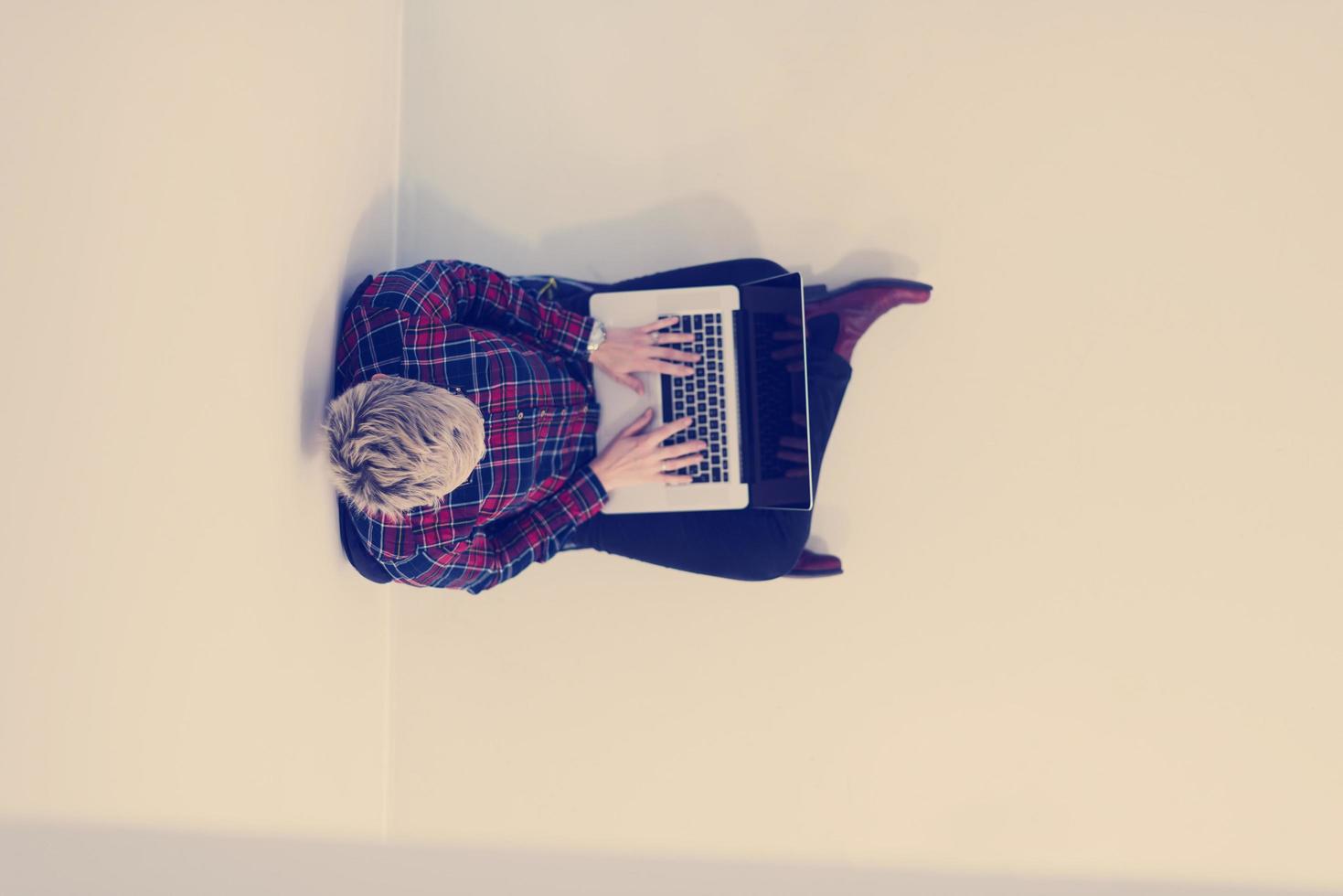 top view of young business woman working on laptop computer photo
