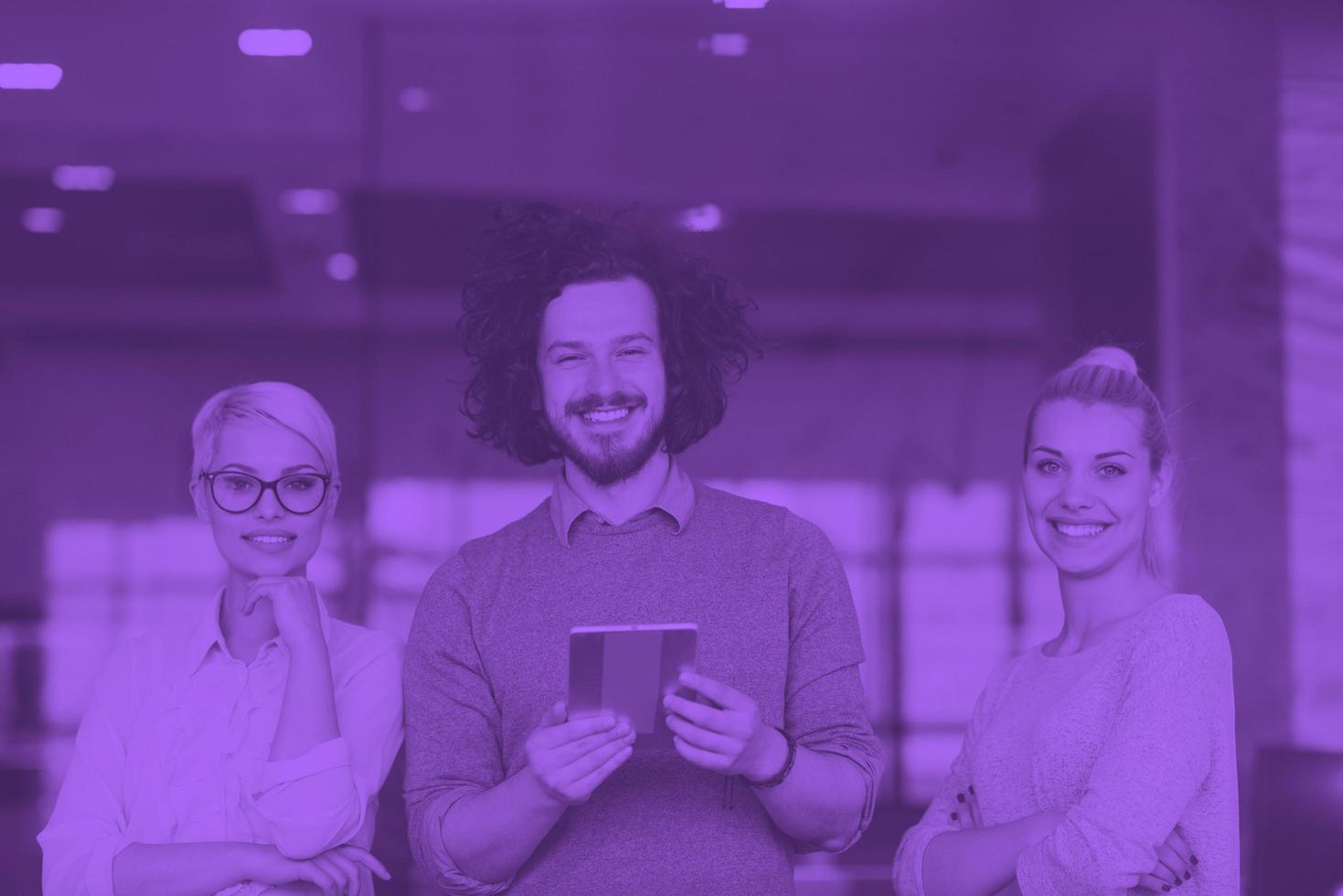 group of Business People Working With Tablet in startup office photo