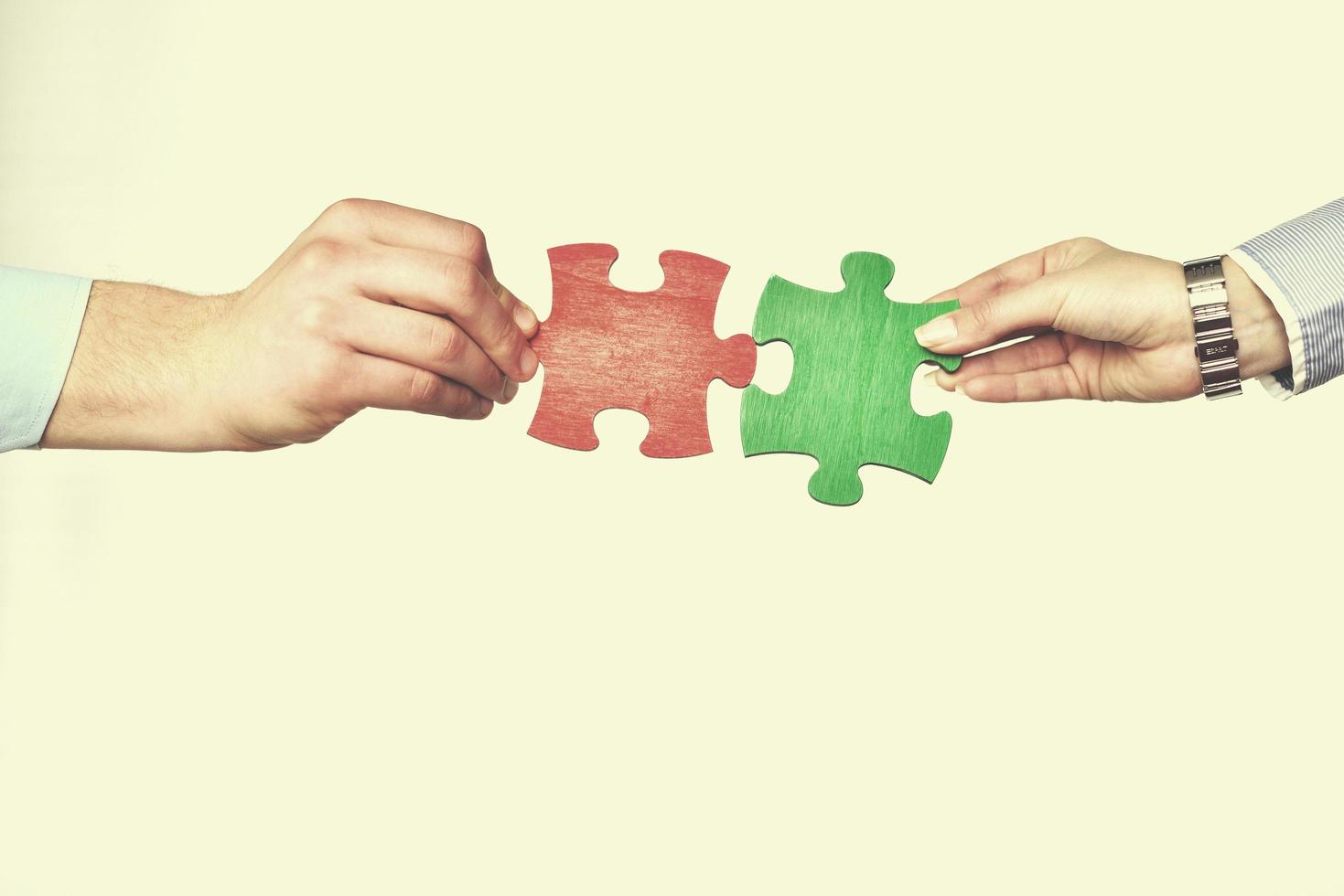 Group of business people assembling jigsaw puzzle photo