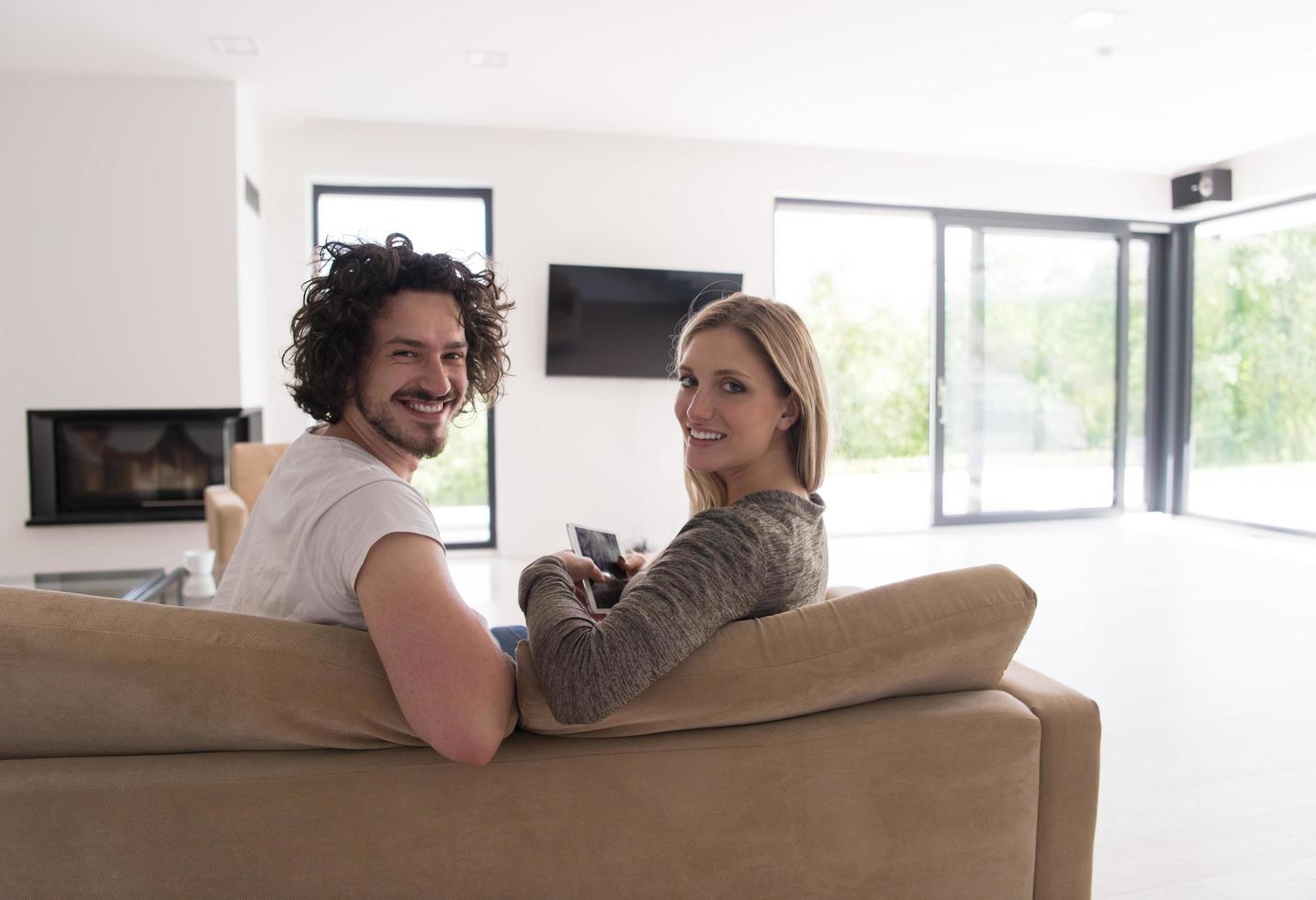 Rear view of couple watching television photo