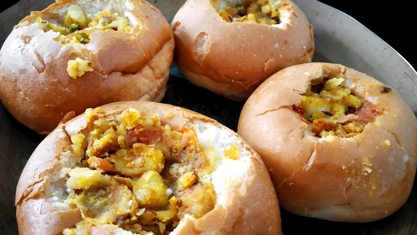 Potatoes baked in a bun with tomato and curd photo