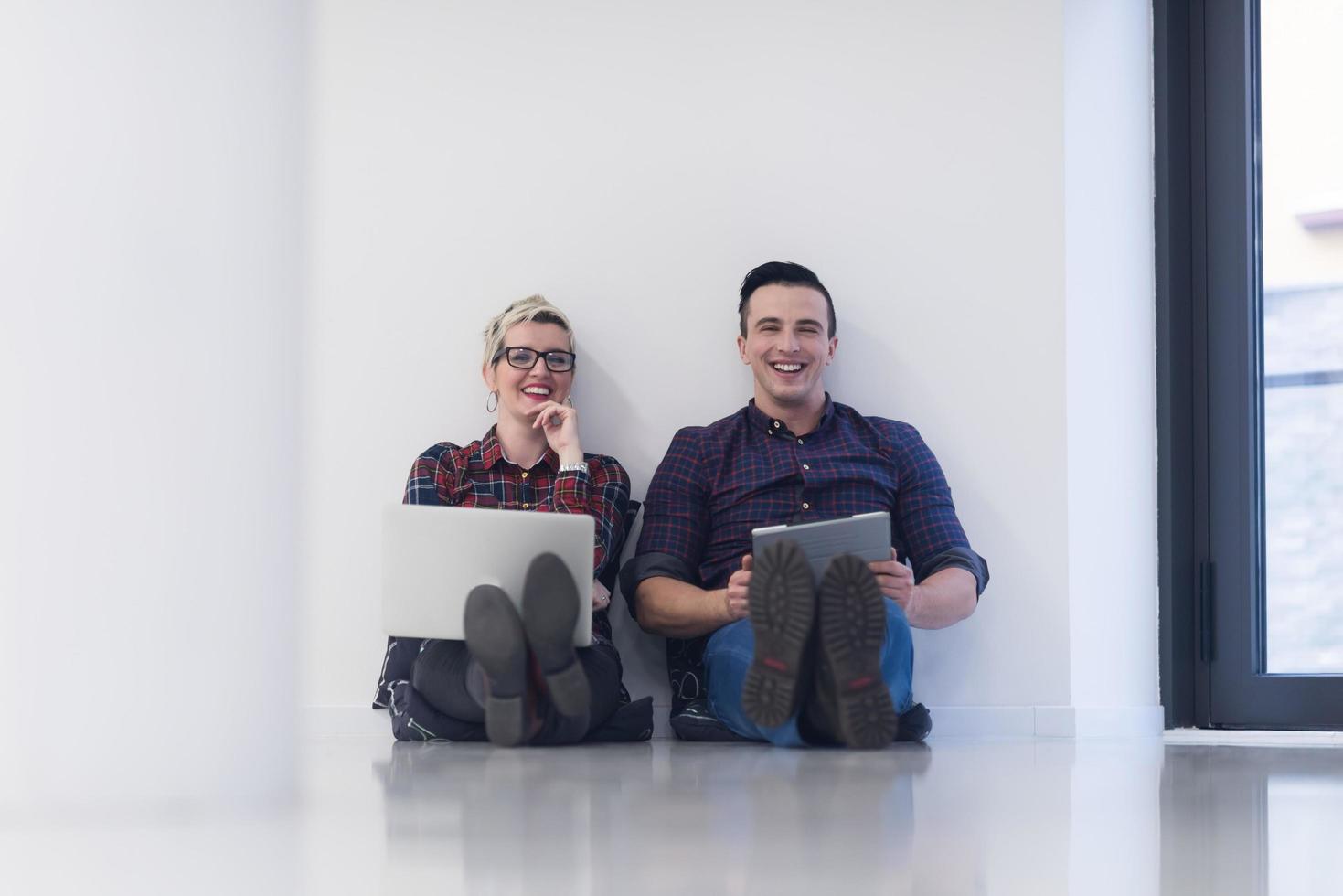 startup business, couple working on laptop computer at office photo