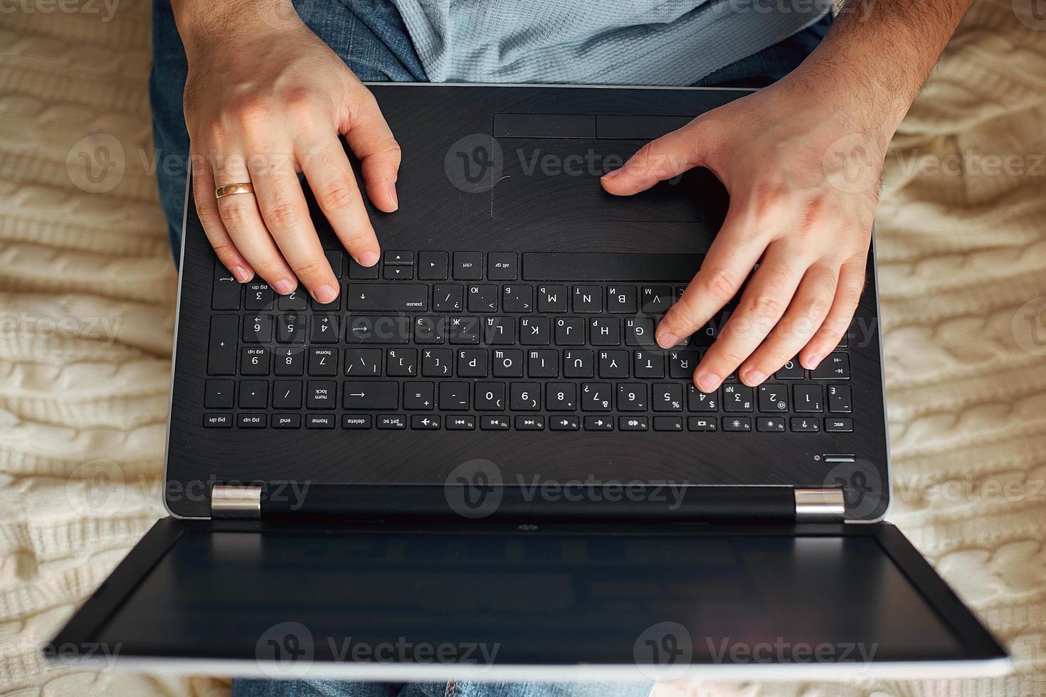 a man works on a laptop, a freelancer develops new goals. photo