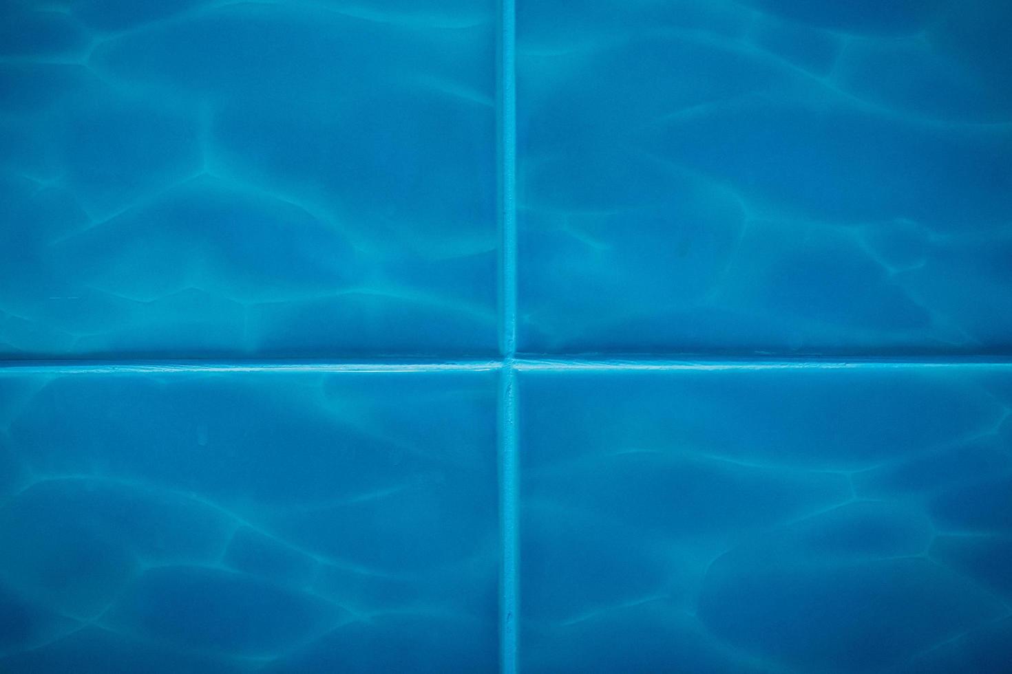 azulejos azules con patrón, fondo y textura de agua de mar foto