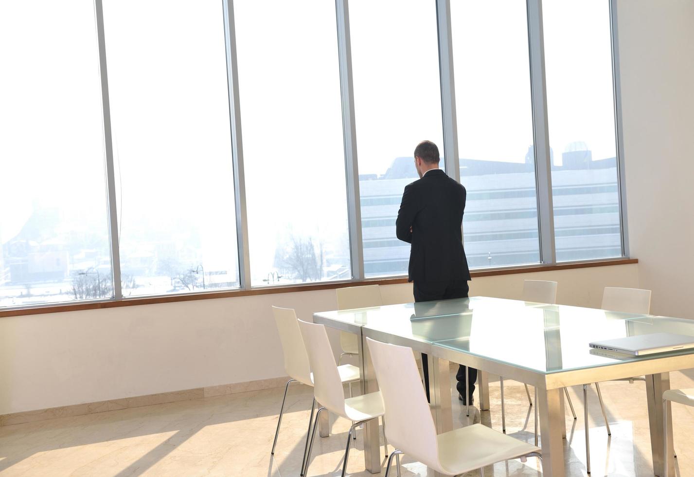 young business man alone in conference room photo