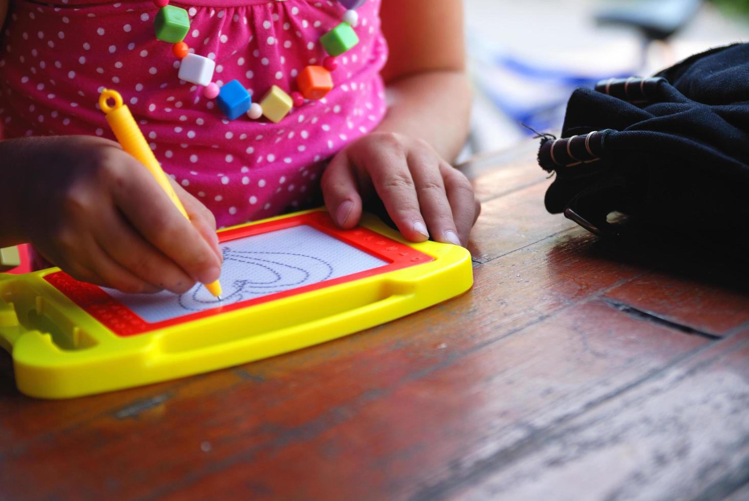 Cute litlle girl drawing photo