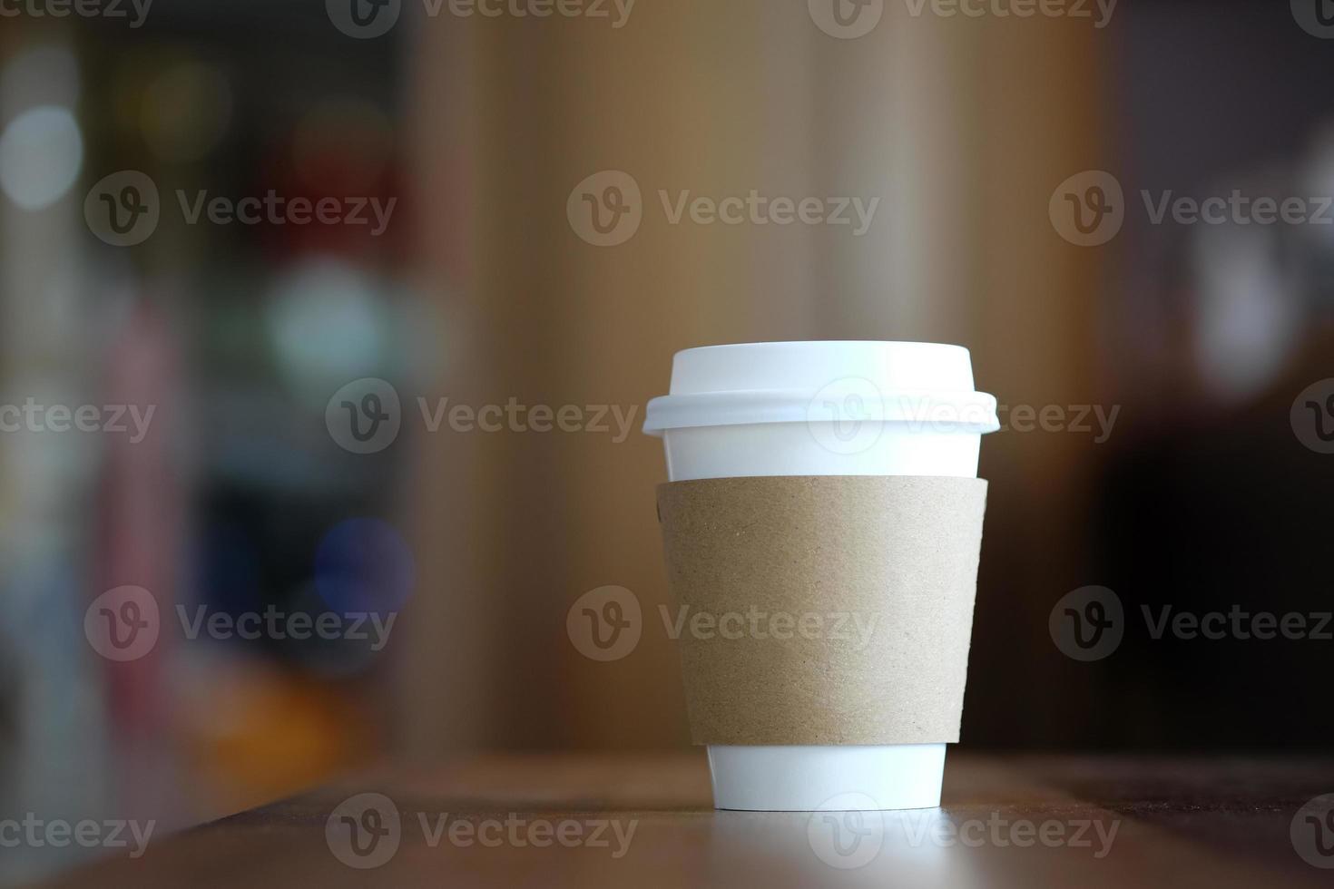 Paper coffee cup in coffee shop. photo
