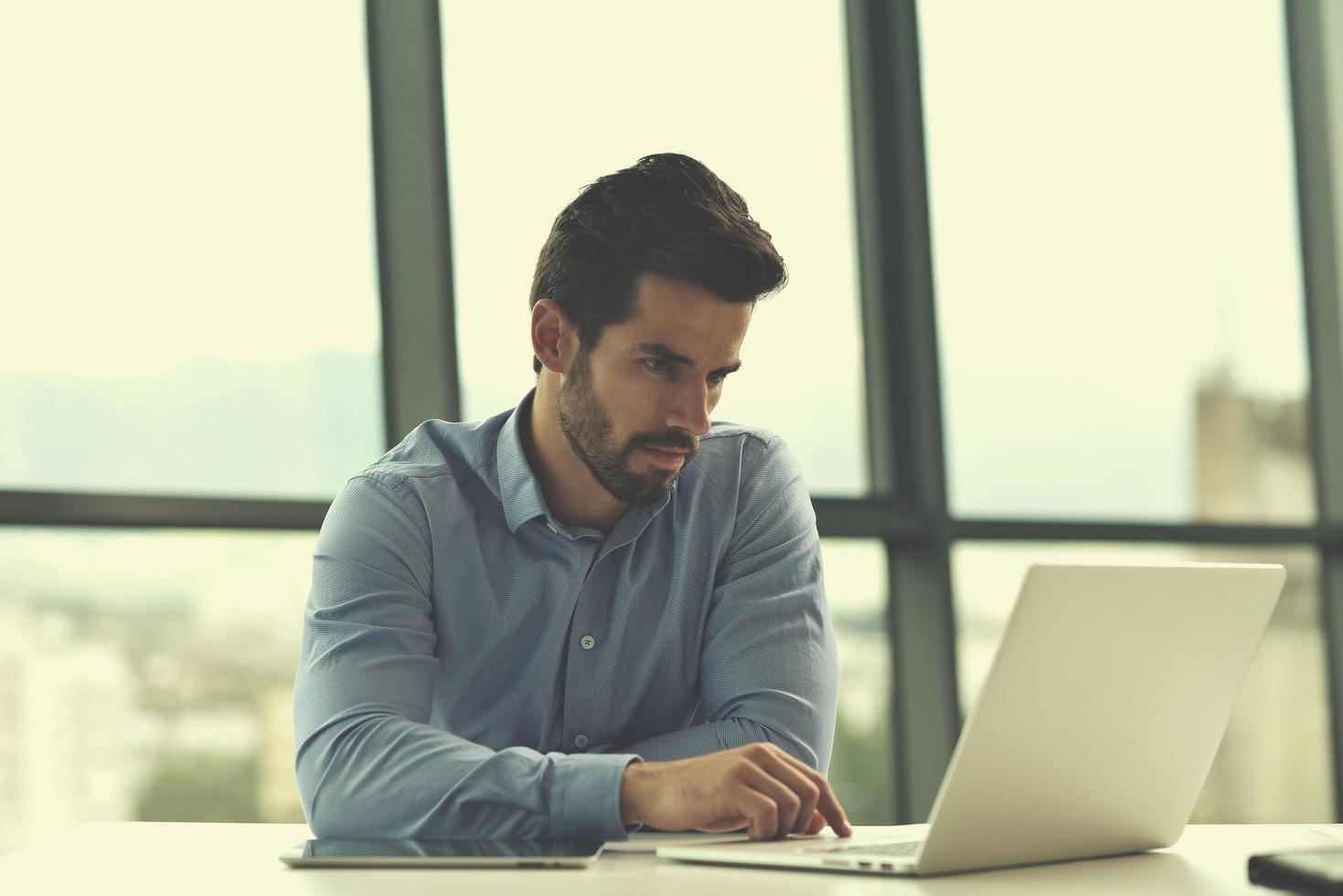 happy young business man at office photo