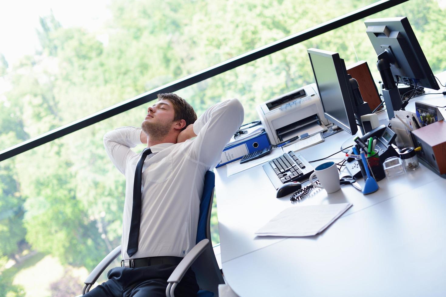 happy young business man at office photo