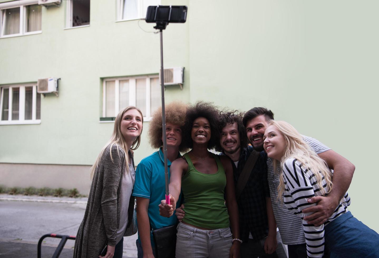 Group of friends taking picture of themselves photo