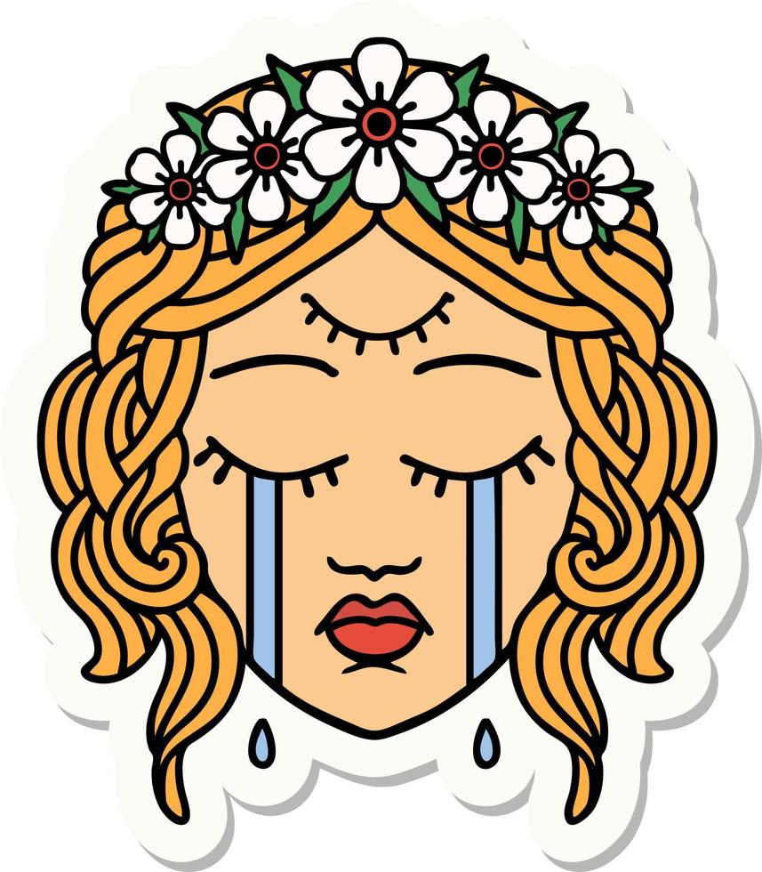 sticker of tattoo in traditional style of female face with third eye and crown of flowers cyring vector