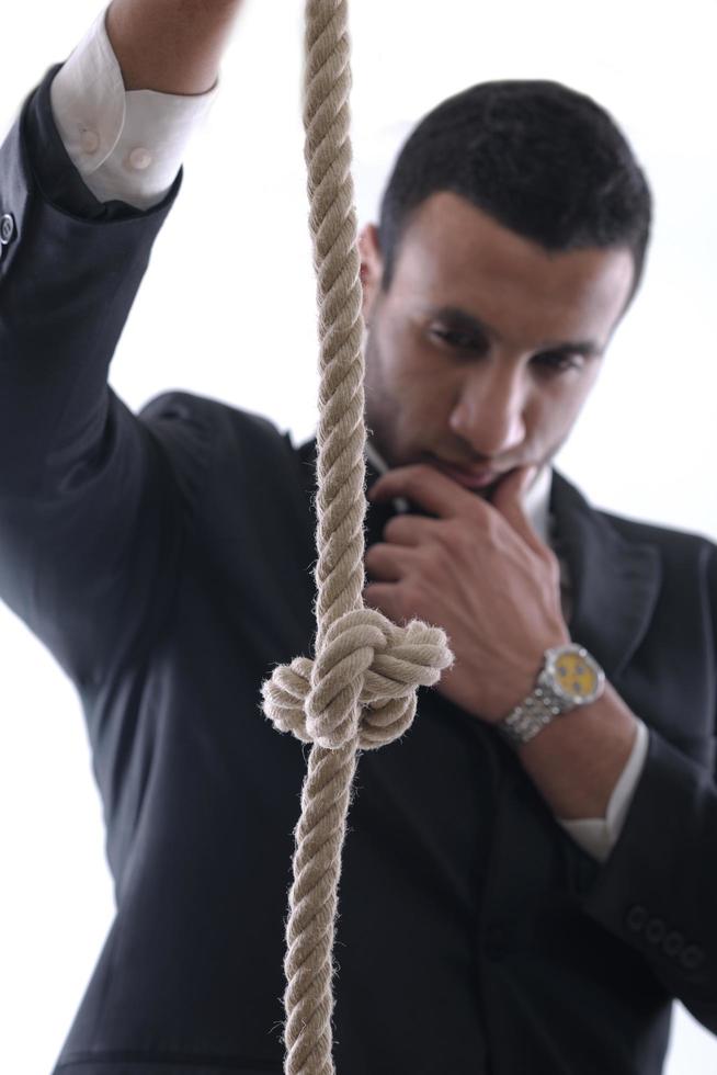 business man with rope isolated on white background photo