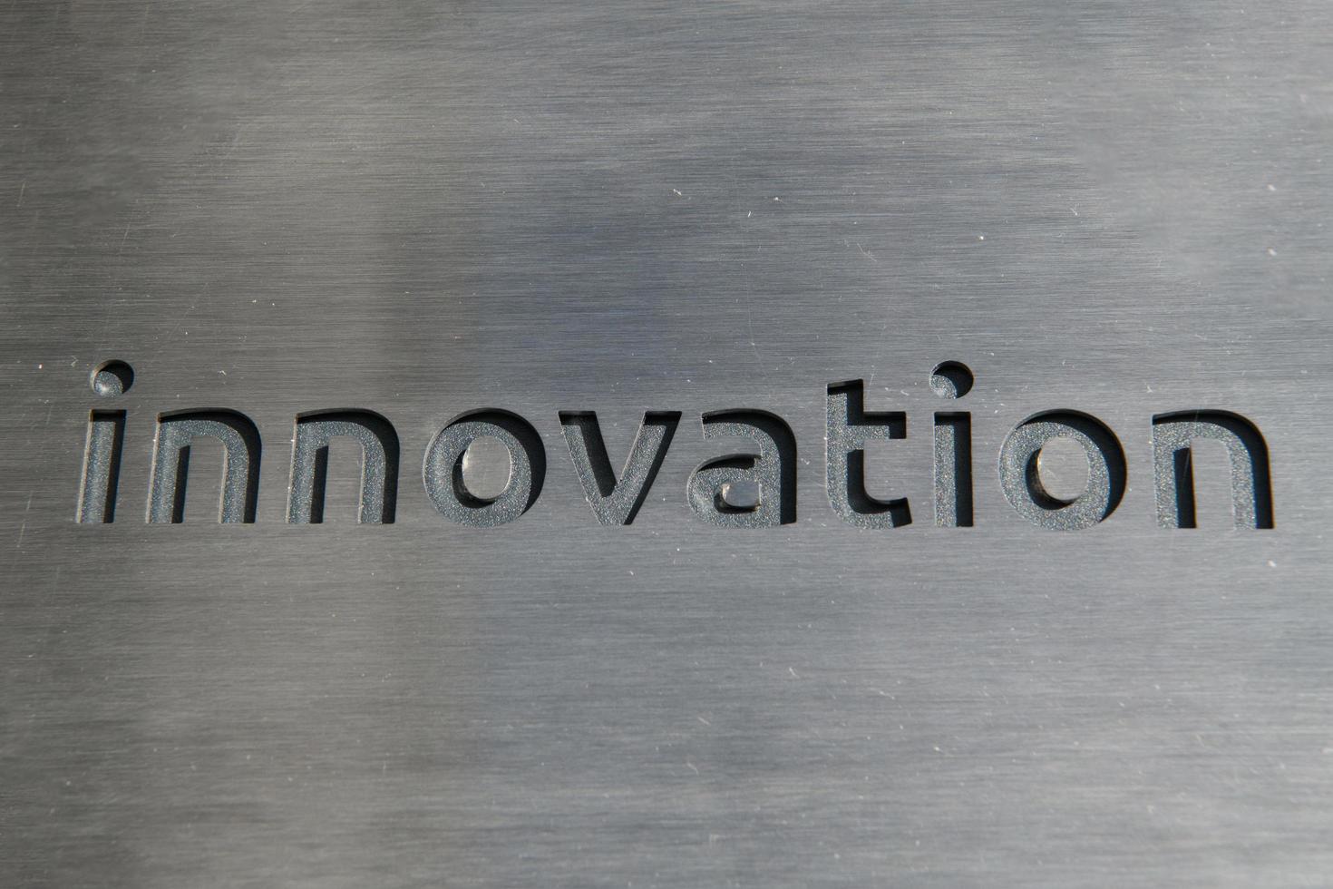 Turkey, 2022 - Engraving a cnc machine on a piece of metal. Engraving innovation text photo