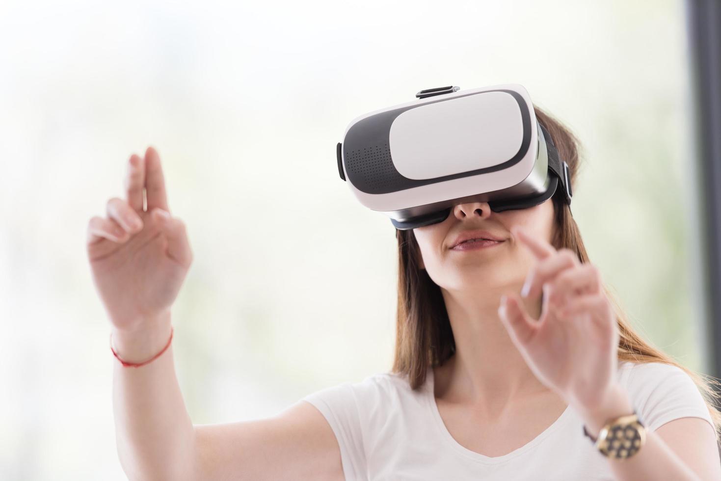 woman using VR-headset glasses of virtual reality photo