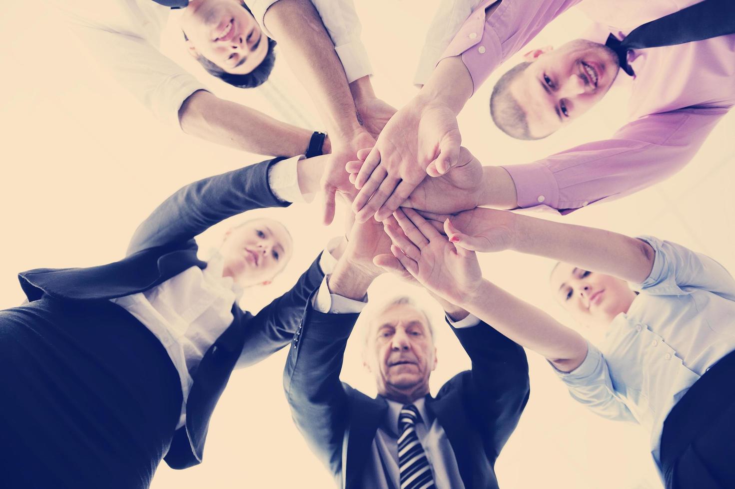 business people group joining hands photo