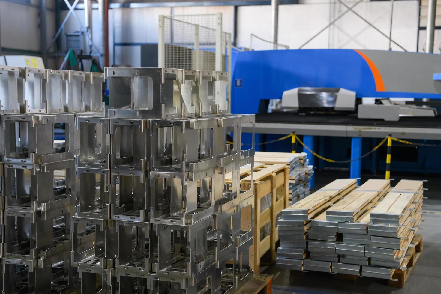 The first phase of metal and aluminum processing. Processed products from CNC machines stacked on a pallet in a large modern factory photo